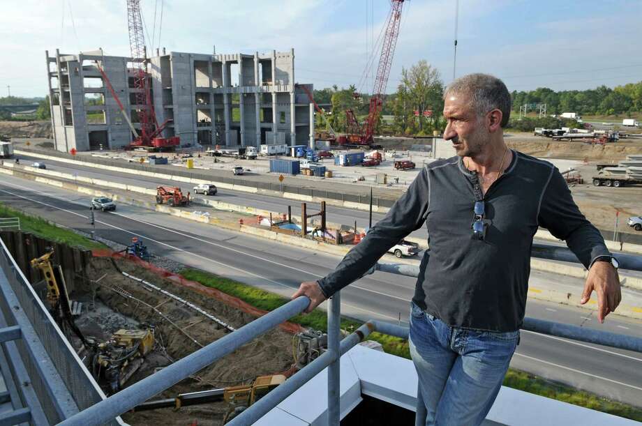 Dr. Alain E. Kaloyeros, Senior Vice President and Chief Executive Officer, College of Nanoscale Science and Engineering, watches new construction across Washington Avenue Extension at the college on Tuesday Sept. 27, 2011 in Albany, NY.  ( Philip Kamrass/Times Union) Photo: Philip Kamrass / 00014779A