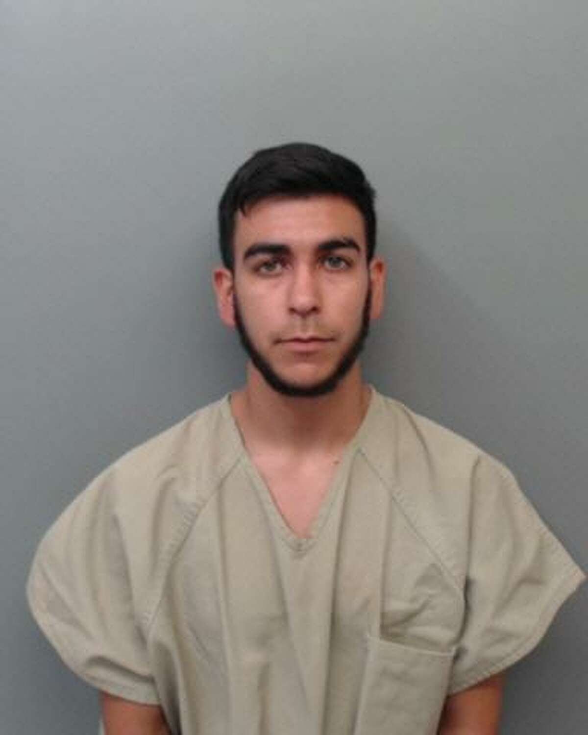 Juan Aaron Garza, 22, was charged with transporting and conspiring to transport immigrants who had crossed the border illegally.