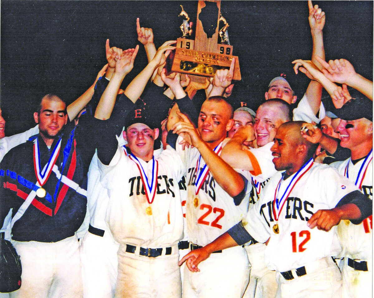 The Edwardsville Tigers celebrating with the Class AA state championship trophy after defeating Tinley Park Andrew in the state title game.