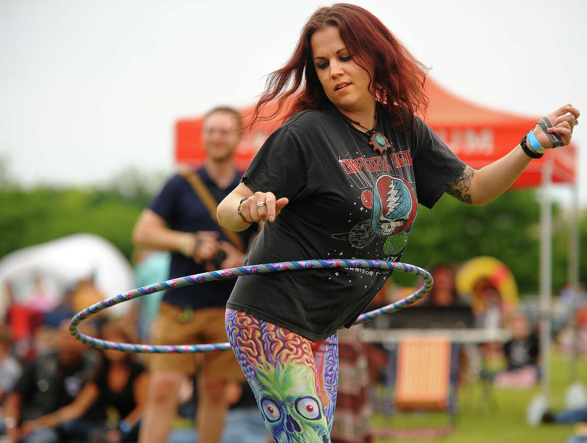 Sara Fegan, of Naugatuck, hula hoops to the music at the Riverfront Music Festival in Shelton, Conn. on Sunday, June 10, 2018.