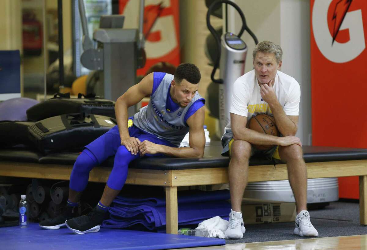 Golden State Warriors' Steph Curry and coach Steve Kerr hanging out near the end of practice at the Warriors practice facility in Oakland, Ca. on Wednesday October 11, 2017.