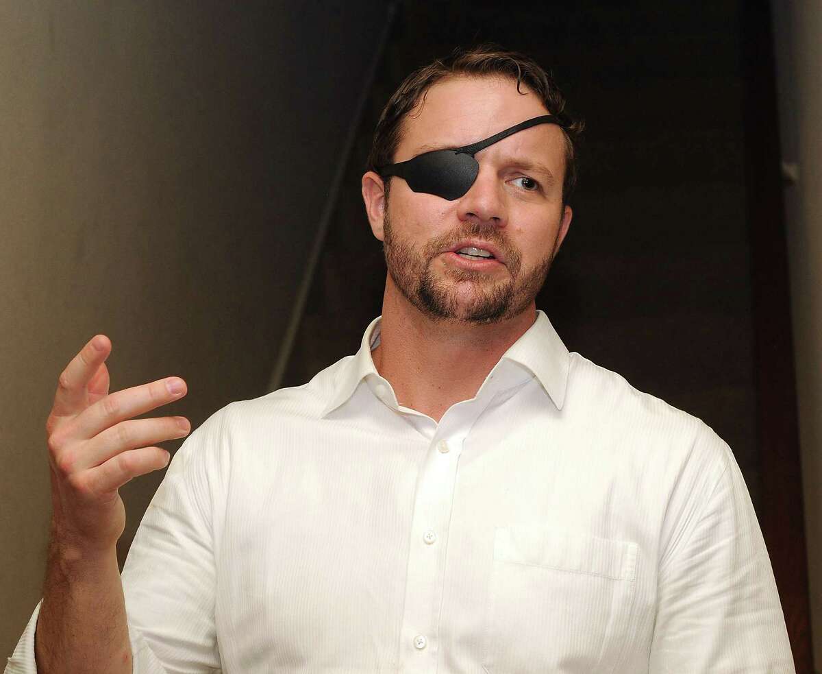 Dan Crenshaw, former NAVY SEAL running for the 2nd Congressional District speaks at a meet-and-greet in the Lazybrook/Timbnergrove neighborhood Saturday May 12 ,2018.(Dave Rossman Photo)