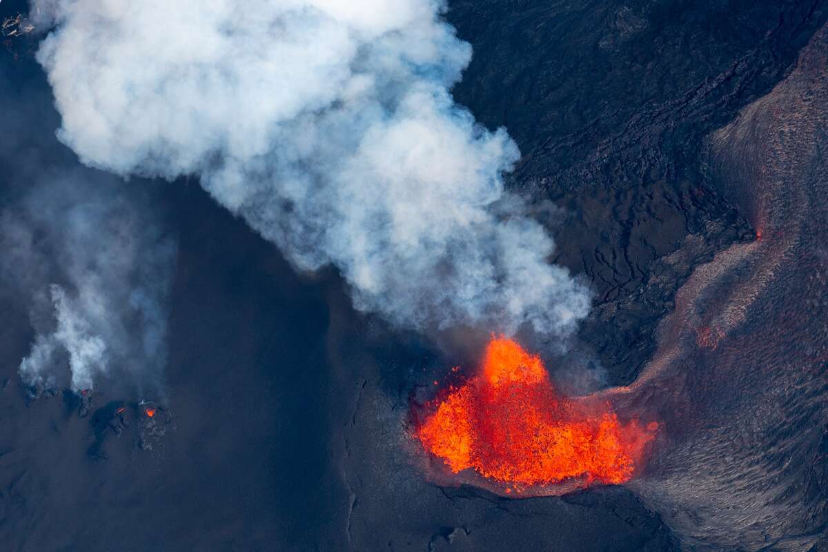 The Fissure 8 fountain, located inside Leilani Estates, spews molten lava on June 1, 2018, in Pahoa, Hawaii.