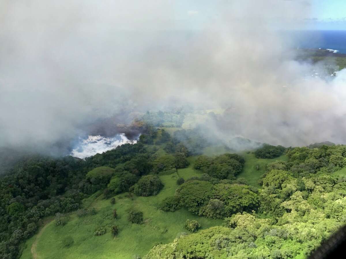 Heated by lava, Hawaii's Green Lake evaporates away on Saturday, June 2. It took less than two hours for the 200-foot-deep lake to disappear.