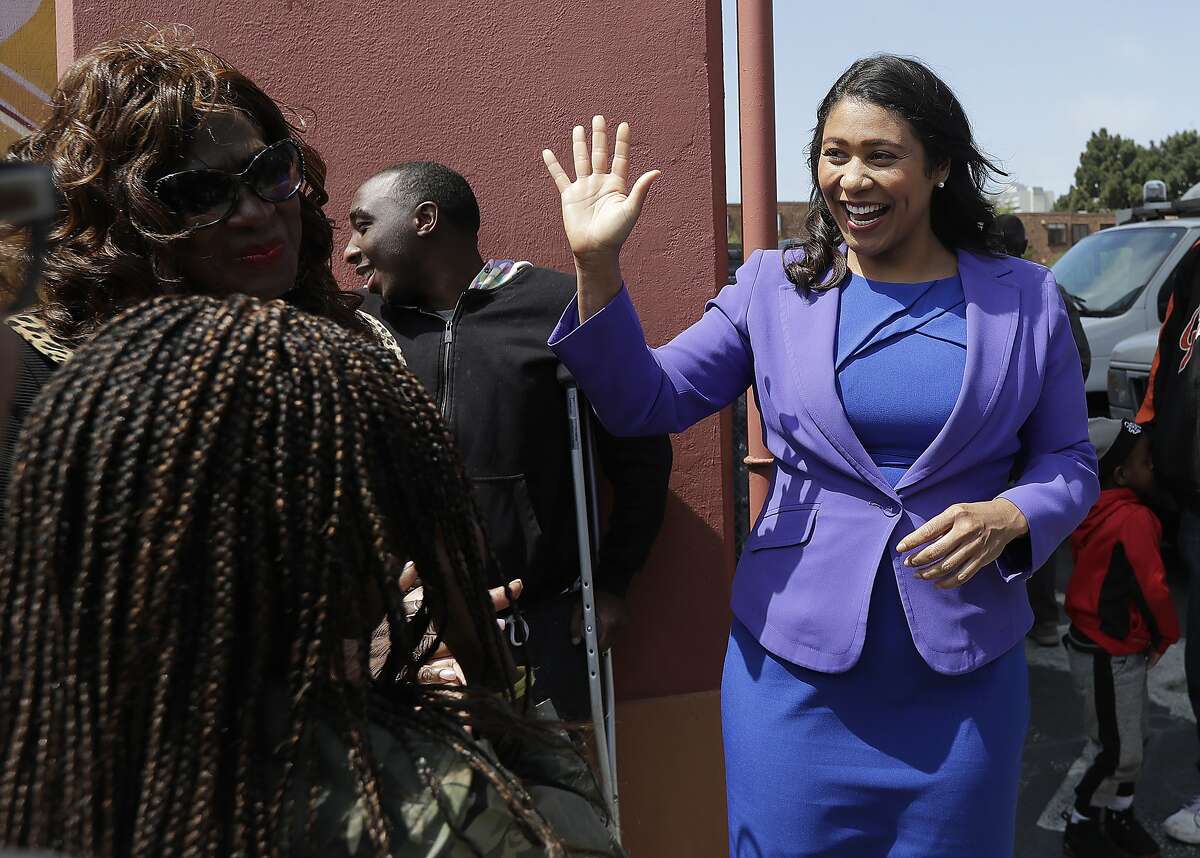 Board of Supervisors President London Breed, right, greets supporters after speaking to reporters in San Francisco, Wednesday, June 6, 2018. Former state Sen. Mark Leno pulled ahead in San Francisco's race for mayor by the slimmest of margins early Wednesday under the city's unusual voting system, although Breed maintained her lead in first-place votes. (AP Photo/Jeff Chiu)