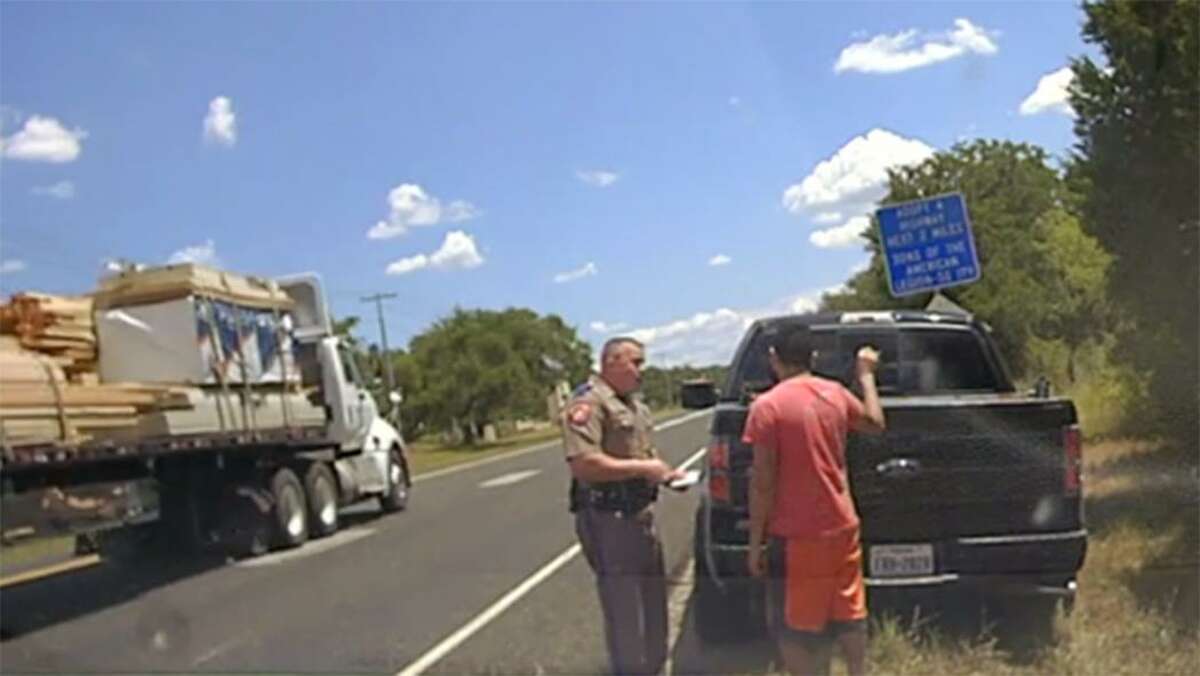 Gaspar Rodriguez Garcia, right, who lives in San Antonio and is in jail, fighting charges of illegal re-entry is shown in an Aug. 23, 2017 dash cam video frame capture being questioned by state trooper Randy Vick. Garcia's immigration case has brought to light a little-know program that forwards the names of people ticketed by DPS to U.S. Immigration and Customs Enforcement officials.