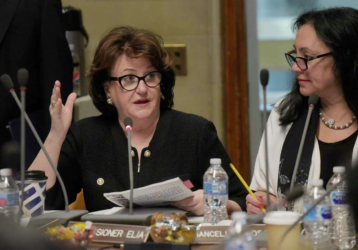 New York State Commissioner of Education MaryEllen Elia, left, addresses those gathered for a New York State Education Department Board of Regents meeting on Monday, June 11, 2018, in Albany, N.Y. Board of Regents Chancellor Betty Rosa, right, looks on. (Paul Buckowski/Times Union)