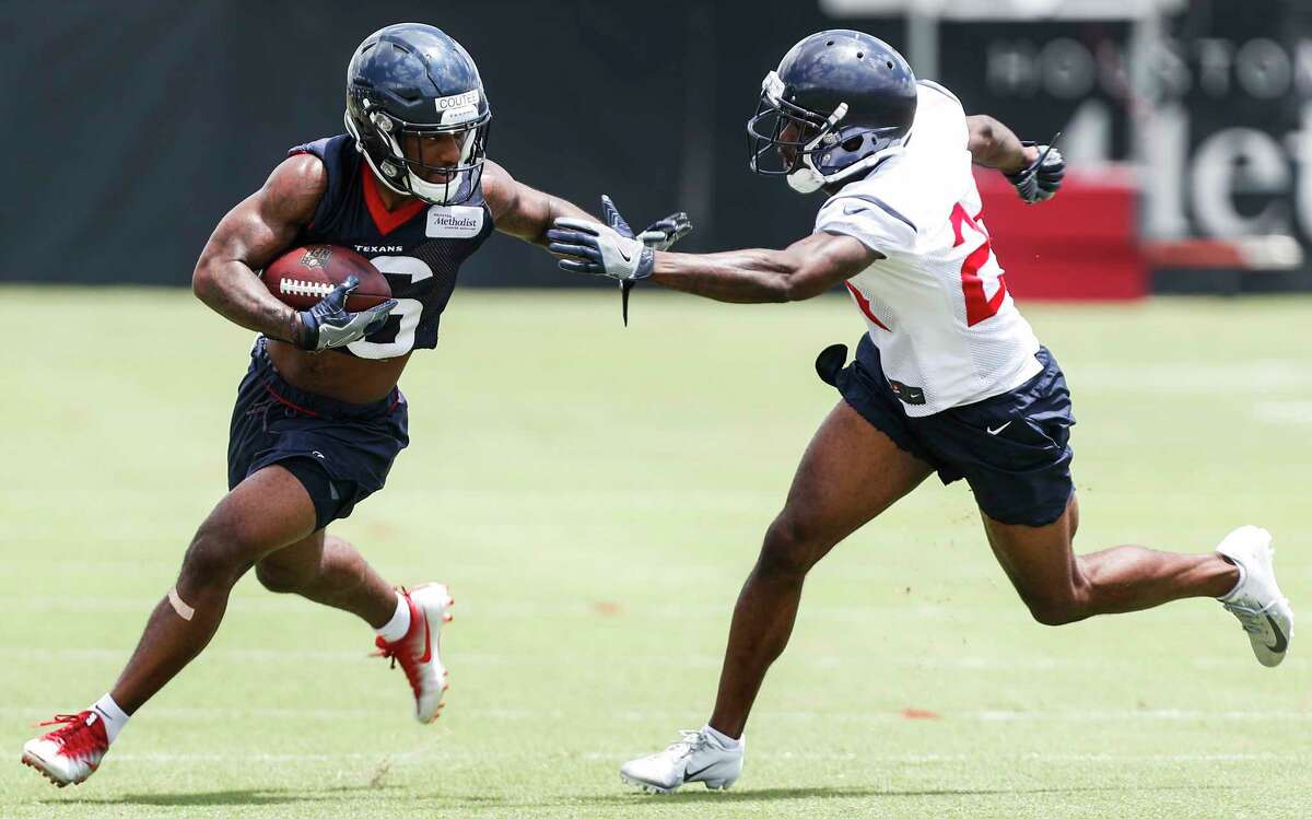 Houston Texans wide receiver Keke Coutee (16) runs against cornerback Johnathan Joseph during mini camp at The Methodist Training Center on Tuesday, June 12, 2018, in Houston.