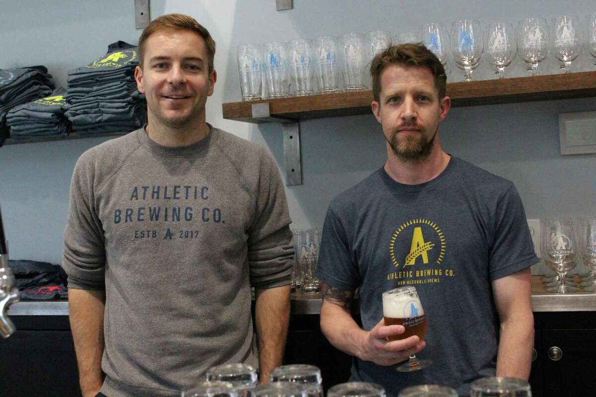 Bill Shufelt, left, and John Walker, owners of Athletic Brewing Co., opened their non-alcoholic brewery a month ago and have hit the ground running with two flagship brews.