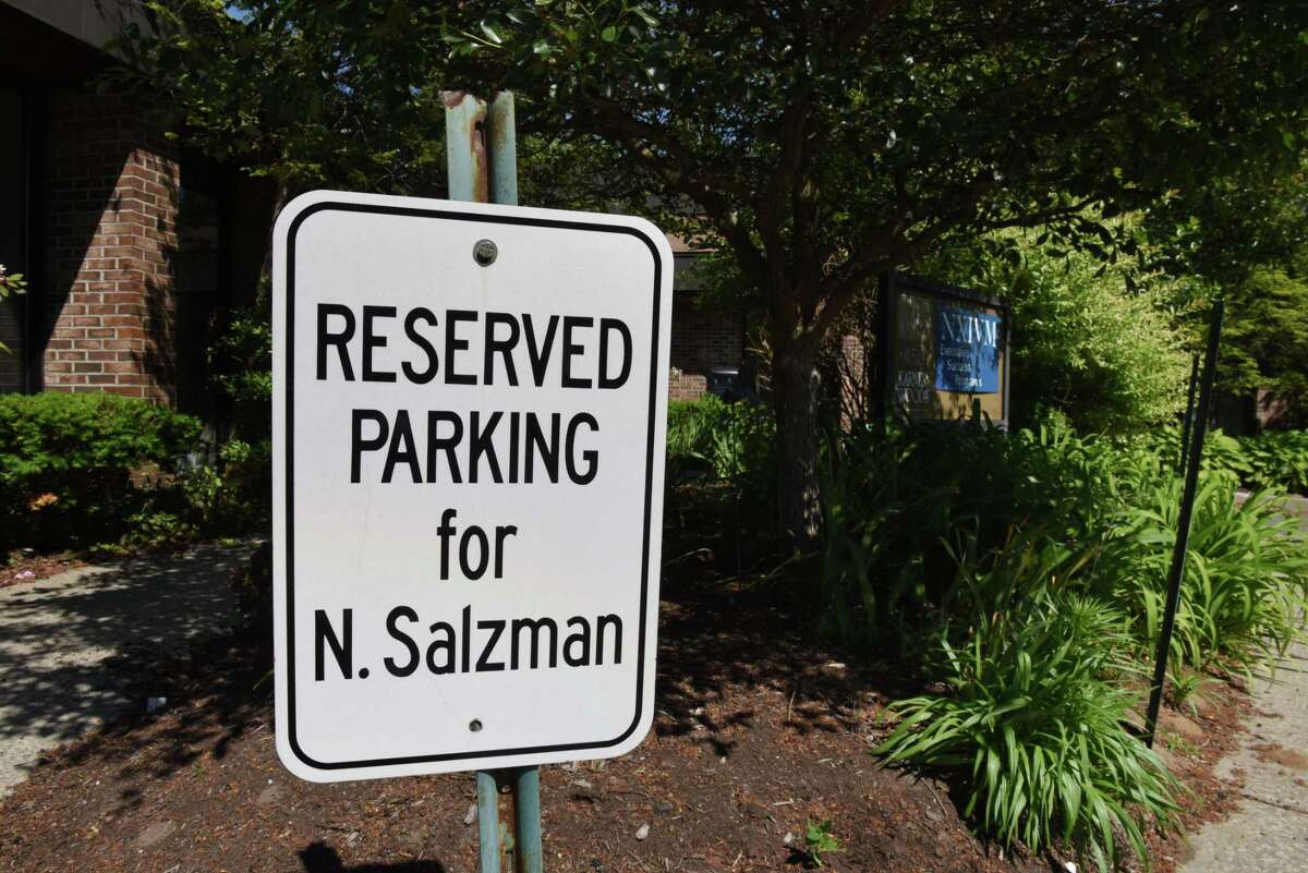 A parking spot reserved for NXIVM president Nancy Salzman is posted outside the group's offices on New Karner Rd. on Tuesday, June 12, 2018, in Colonie, N.Y. NXIVM announced it was suspending all operations and planned events. (Will Waldron/Times Union)