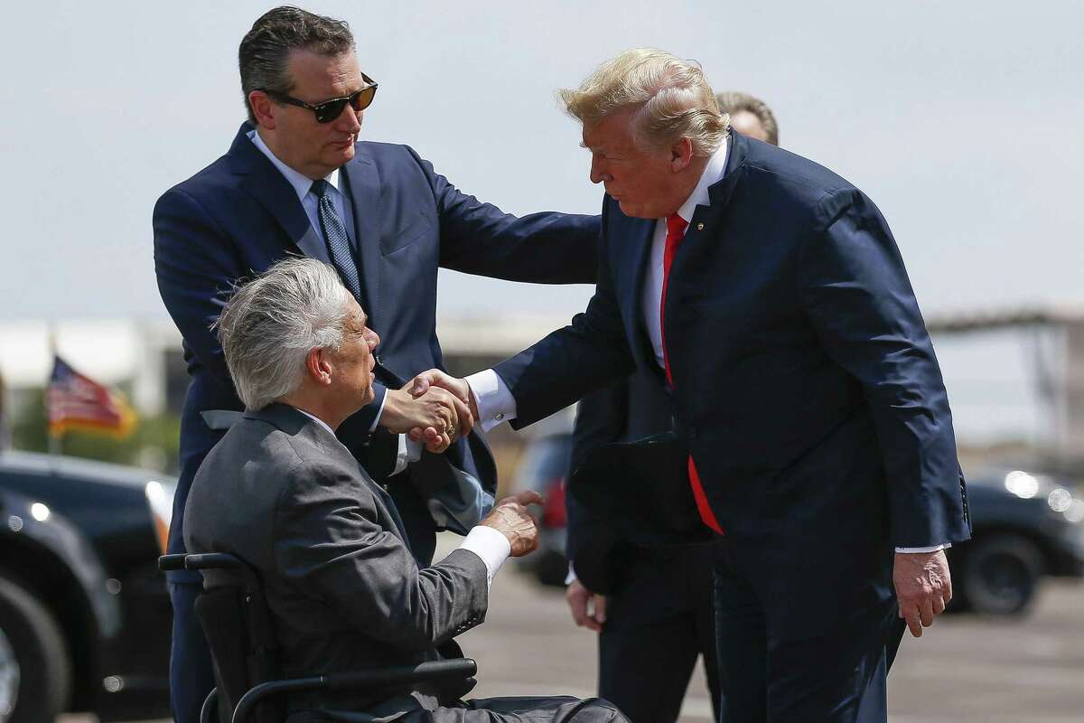 President Donald Trump meets with Senator Ted Cruz, top left, and Governor Greg Abbott after landing at Ellington Field Joint Reserve Base Thursday, May 31, 2018 in Houston. Trump is scheduled to meet with those affected by the Santa Fe High School Shooting before attending a fundraiser. (Michael Ciaglo / Houston Chronicle)