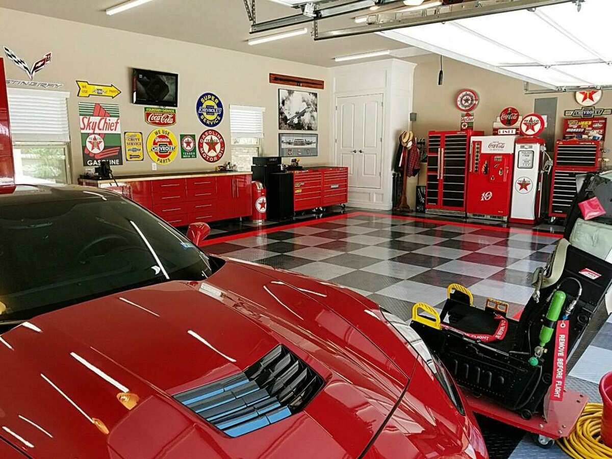 In designing this tricked-out garage in his new home in Fair Oaks, retired Air Force Master Sergeant Ed Hobbs wanted a look that would show off his red 2015 Corvette Stingray. The concept was designed by Premier Garage.