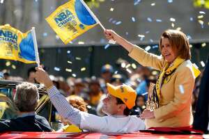 Nancy Pelosi during Golden State Warriors' victory parade down Broadway in Oakland, Calif., on Friday, June 19, 2015.
