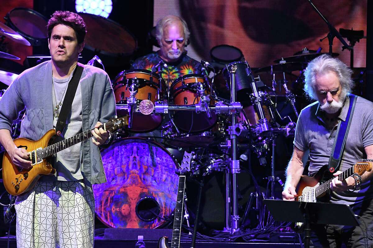 Dead & Company including John Mayer, left, Bill Kreutzmann, center, and Bob Weir perform the song "Jack Straw" at Saratoga Performing Arts Center on Monday, June 11, 2018 in Saratoga Springs, N.Y. Lawn Pass for SPAC, which connects music lovers to lawn seats all summer long, is returning for the 2023 summer concert season which includes Dead & Company's final tour. Tickets are on sale on Dec. 8, 2022 for previous pass holders and Dec. 14 for the general public. (Lori Van Buren/Times Union)