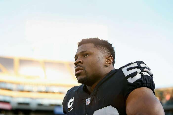 Oakland Raiders quarterback Derek Carr (4) celebrates with defensive end  Khalil Mack (52) during the second half of an NFL football game against the  Buffalo Bills in Oakland, Calif., Sunday, Dec. …