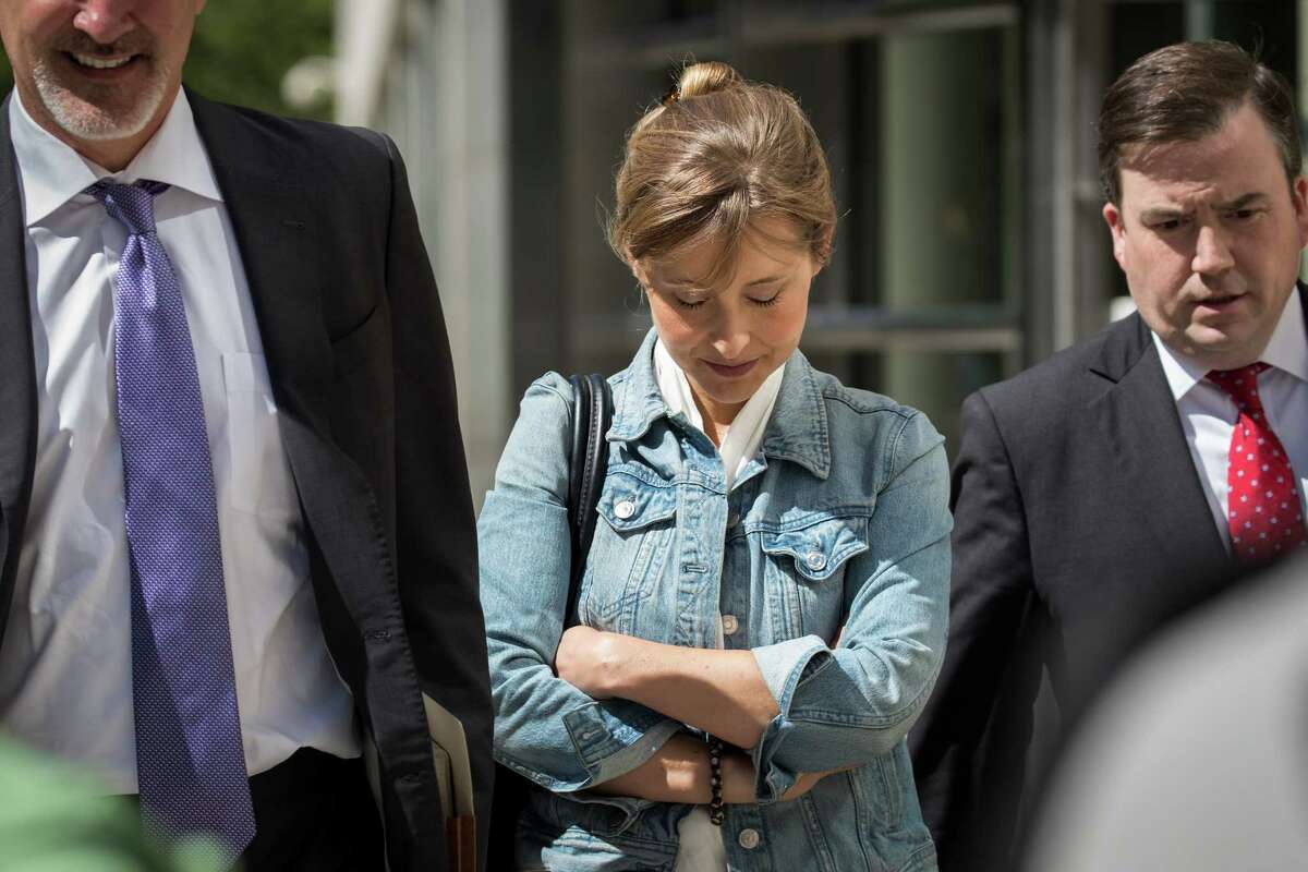 Actress Allison Mack exits the U.S. District Court for the Eastern District of New York following a status conference, June 12, 2018 in the Brooklyn borough of New York City. Mack was charged in April with sex trafficking for her involvement with a self-help organization for women that forced members into sexual acts with their leader. The group, called Nxivm, was led by founder Keith Raniere, who was arrested in March on sex-trafficking charges.