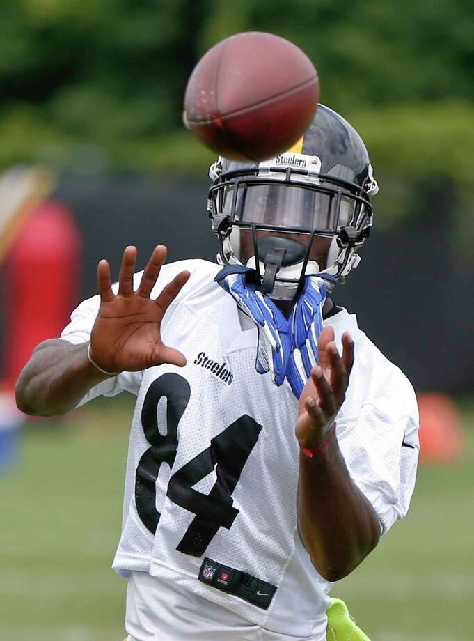 Pittsburgh Steelers wide receiver Antonio Brown makes a catch in a drill during an NFL football practice, Tuesday, June 12, 2018, in Pittsburgh. Brown says he skipped the final two weeks of organized team activities to spend time with his family and not because quarterback Ben Roethlisberger also bailed on the voluntary sessions. Brown added he doesn't feel much "freedom" lately due to pressure from outside forces. (AP Photo/Keith Srakocic) Photo: Keith Srakocic / Copyright 2018 The Associated Press. All rights reserved.
