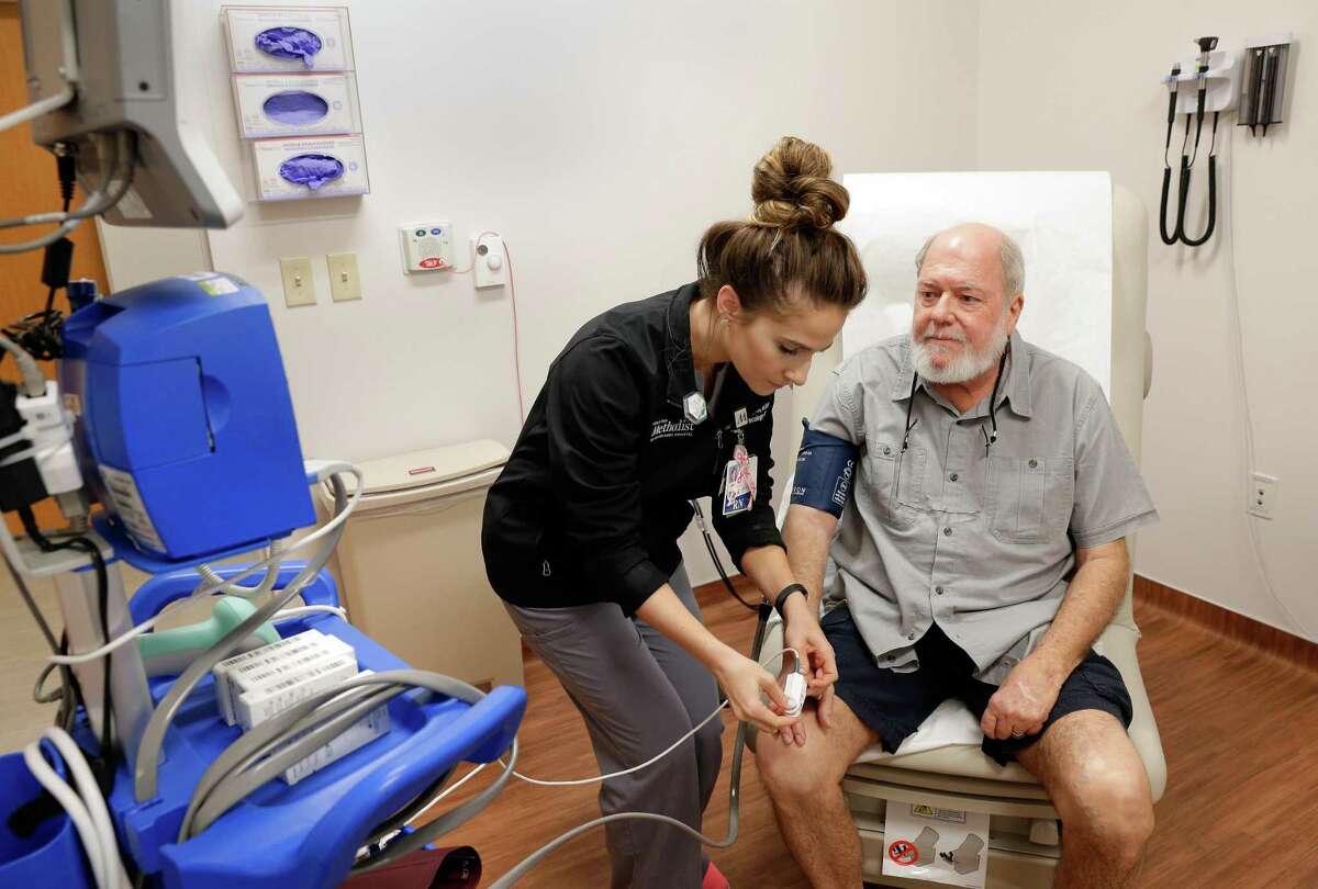 Abbie Ives, RN, takes the vital signs of cancer patient Randall Boeller during a follow up visit in the cancer treatment center at Houston Methodist hospital Friday, May 25, 2018, in The Woodlands. Hospitals are among Houston’s biggest employers.