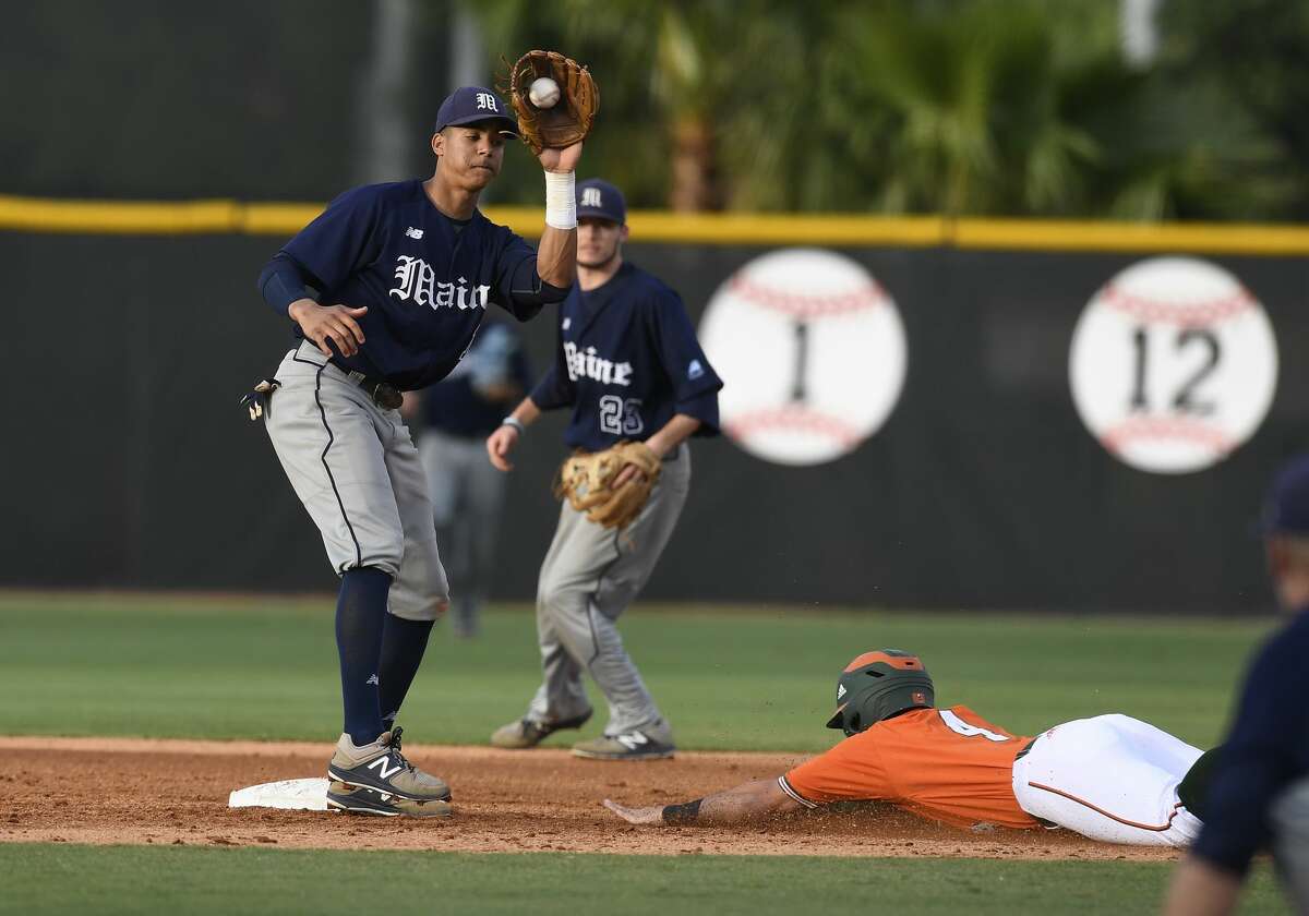 CORAL GABLES, FL - MARCH 14: Miami infielder Johnny Ruiz (4) steals second as Maine infielder Jeremy Pena (14) takes the throw during a college baseball game between the University of Maine Black Bears and the University of Miami Hurricanes on March 14, 2017 at Alex Rodriguez Park at Mark Light Field, Coral Gables, Florida. Miami defeated Maine 4-3. (Photo by Richard C. Lewis/Icon Sportswire via Getty Images)