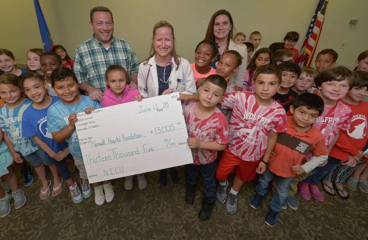 Thirty-five second graders from Wolfpit Elementary School and their teachers, Sean Sulliivan and Samantha Verboven, visit Norwalk Hopsital Wednesday, June 13, 2018, to donate over $13,000 to Dr. Alicia Briggs, Department Chair of Pediatrics, and the NICU at the Hospital in Norwalk, Conn. The students raised the money, as they have for the past 14 years, by writing persuasive letters to perspective donors. This will bring their total donation to the NICU to over $30,000. This is in addition to the over $50,000 that second graders have raised for the Wittingham Cancer Center over the years.