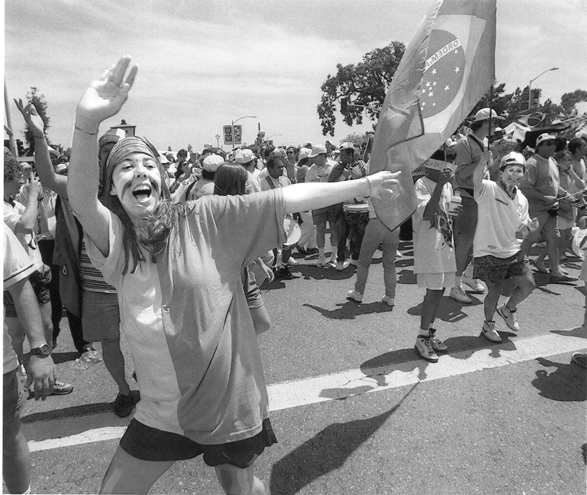 Brazilian fans dance to drums on El Camino and outside Stanford Stadium before start of the World Cup game, June 20, 1994