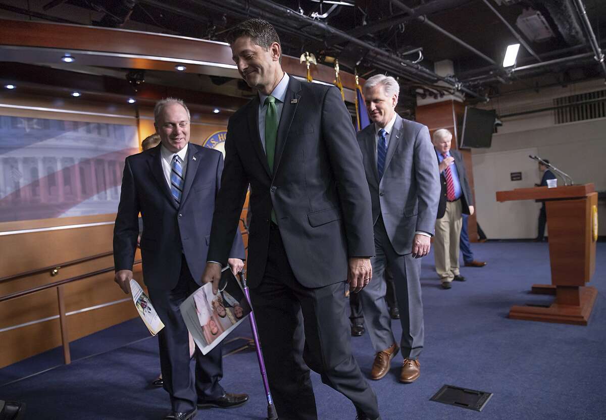 Speaker of the House Paul Ryan, R-Wis., flanked by House Majority Whip Steve Scalise, R-La., left, and Majority Leader Kevin McCarthy, R-Calif., departs a news conference following a closed-door GOP meeting on immigration, on Capitol Hill in Washington, Wednesday, June 13, 2018. The Wisconsin Republican gave an upbeat assessment to reporters after brokering a deal between party factions on a process to consider rival GOP immigration plans to protect young "Dreamer" immigrants brought illegally to the U.S. as children.(AP Photo/J. Scott Applewhite)
