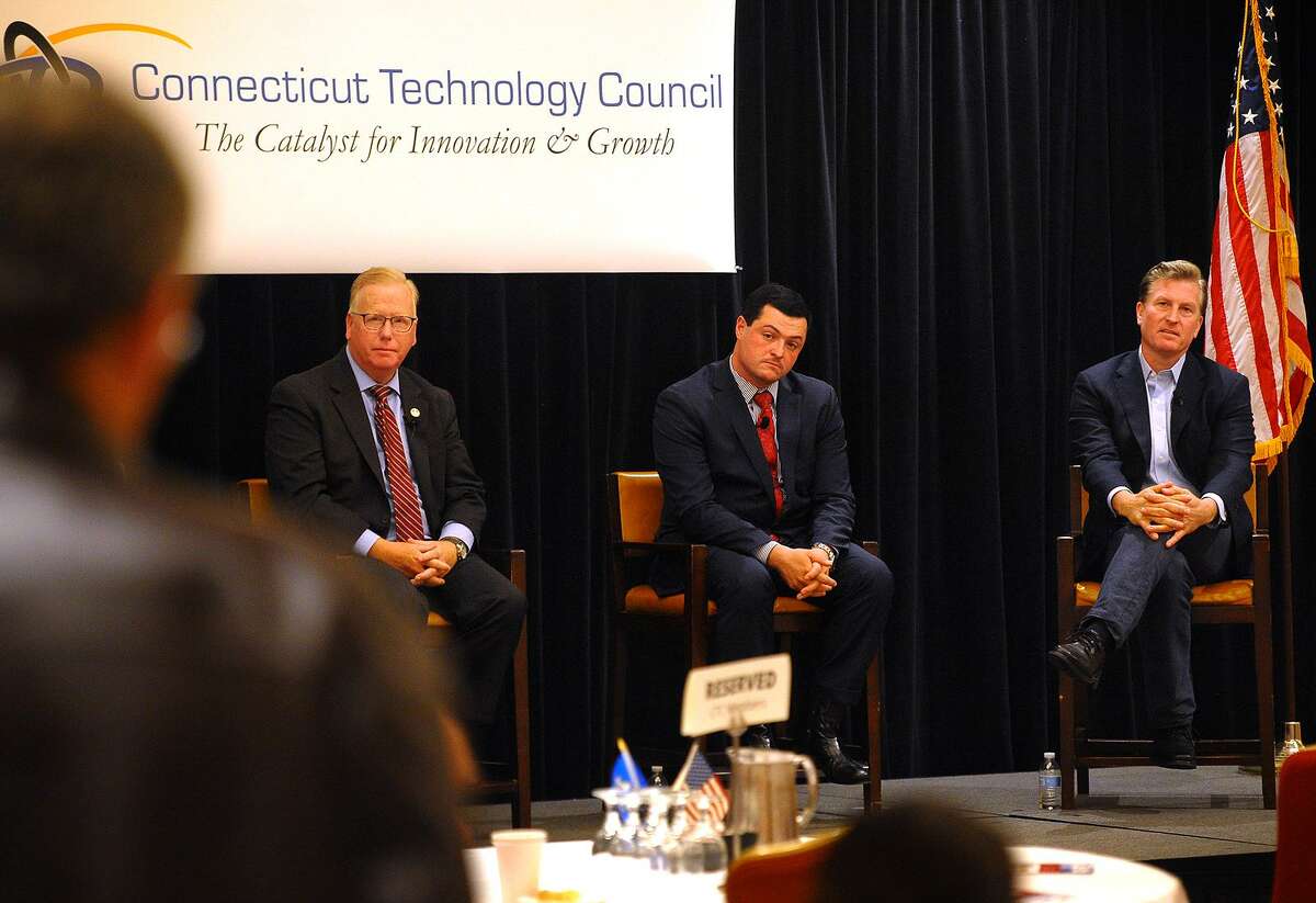 From left; Republican candidates for governor Mark Boughton, Tim Herbst, and Steve Obsitnik field questions from the audience during a gubernatorial forum sponsored by the CT Technology Council at the Trumbull Marriott in Trumbull, Conn. on Wednesday, June 13, 2018.
