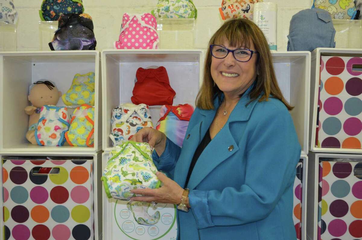 Sandra Beck, founder and CEO of Tidy Tots Diapers, poses with her product, which is available online at Buy Buy Baby, Bed Bath & Beyond, Walmart, JC Penny and Amazon. (Caroline Boardman, Buzz Media Solutions)