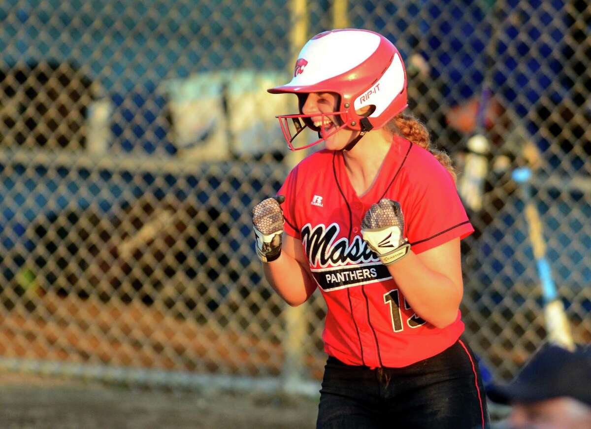 Masuk's Erica Pullen (15) reacts after scoring a run during Class L softball championship action against Brookfield in West Haven, Conn. on Friday June 8, 2018.