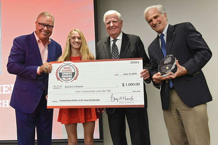 Saratoga Springs track and field star athlete Kelsey Chmiel, second from left, stands with former NFL quarterback and ESPN analyst Ron Jaworski, left, Robert Curley, New York Chairman of Berkshire Bank, second from right and Times Union Editor Rex Smith during the Times Union's Inaugural High School Sports Awards at the Hearst Media Center on Wednesday, June 13, 2018 in Colonie, N.Y. Kelsey won the female Outstanding Athlete of the Year Scholarship award. (Lori Van Buren/Times Union) Photo: Lori Van Buren / 20043995A