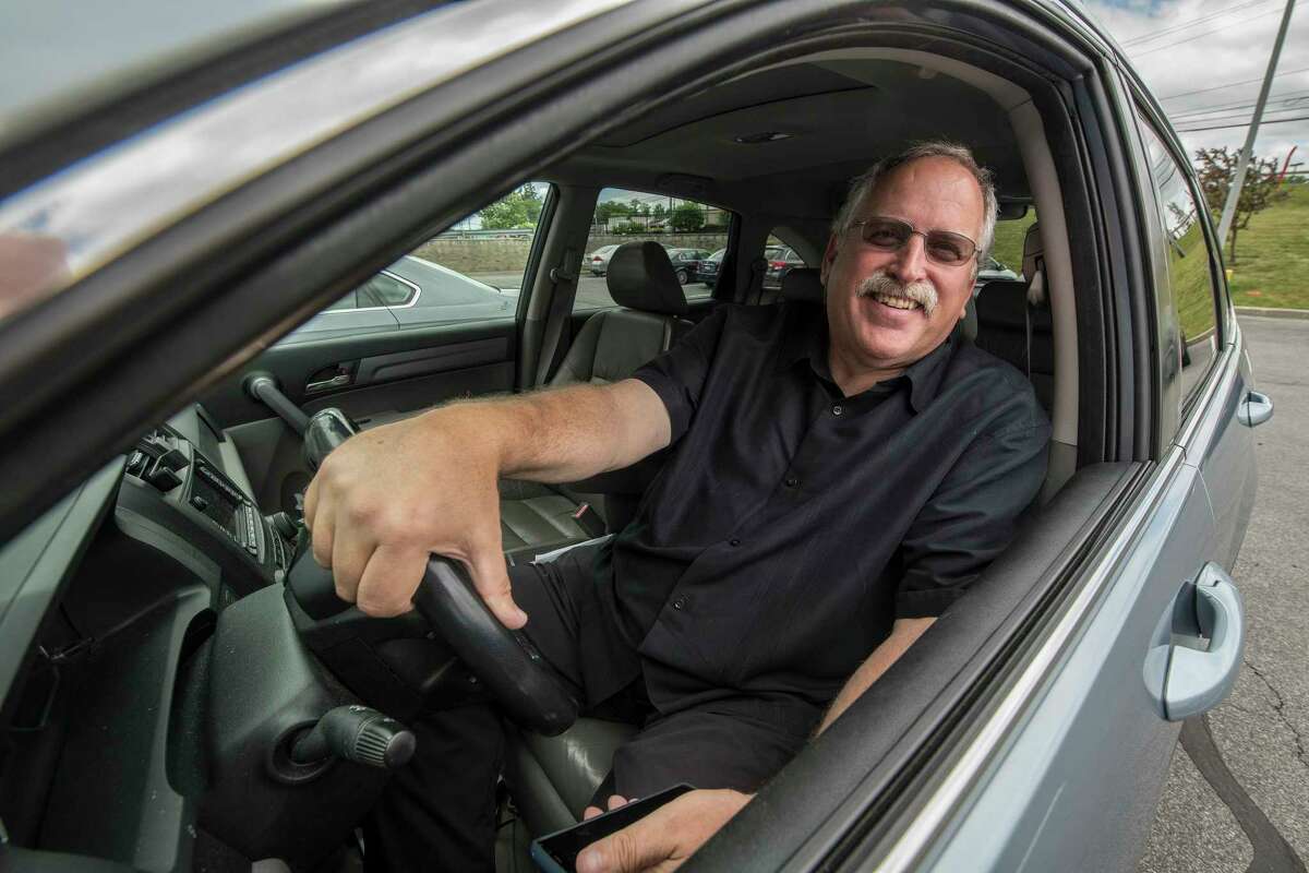 Former Mayor of Schenectady Al Jurczynski smiles from his Uber ride at Mohawk Mall Thursday June 14, 2018 in Niskayuna, N.Y. (Skip Dickstein/Times Union)