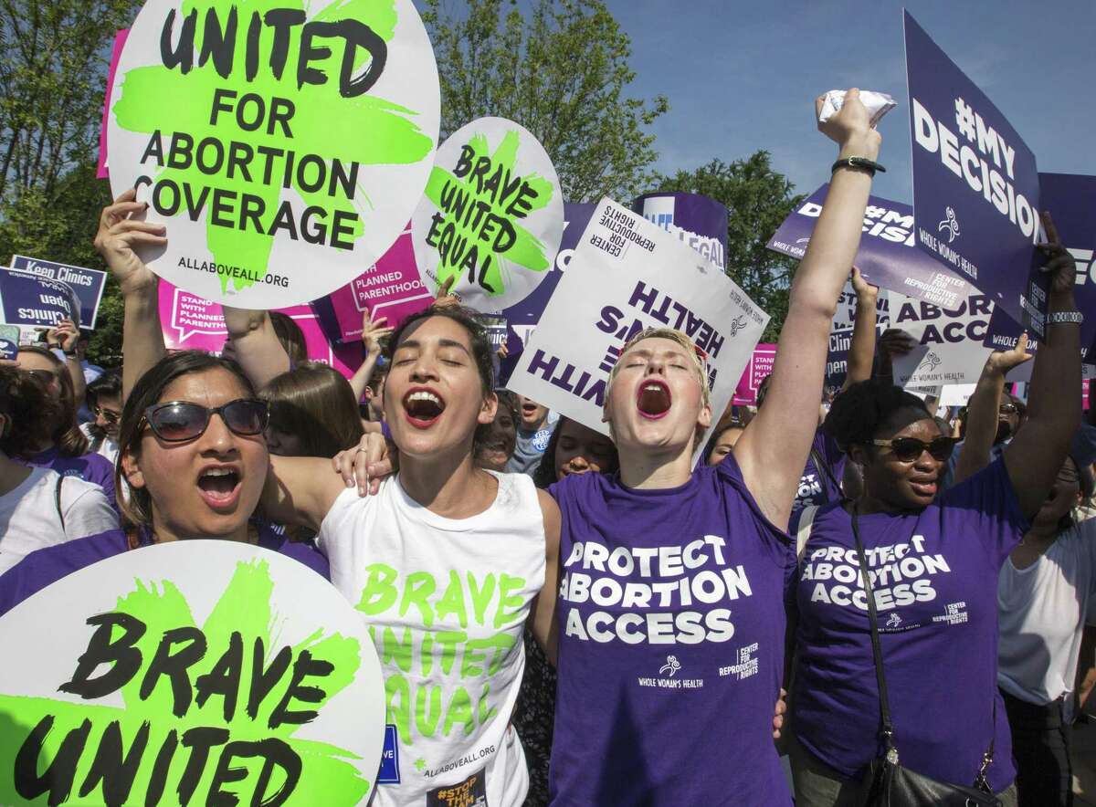 Abortion rights activists rejoice in front of the Supreme Court in Washington in June 2016 as the justices struck down the strict Texas anti-abortion restriction law known as HB2. Keep clicking to see the history of abortion in Texas.