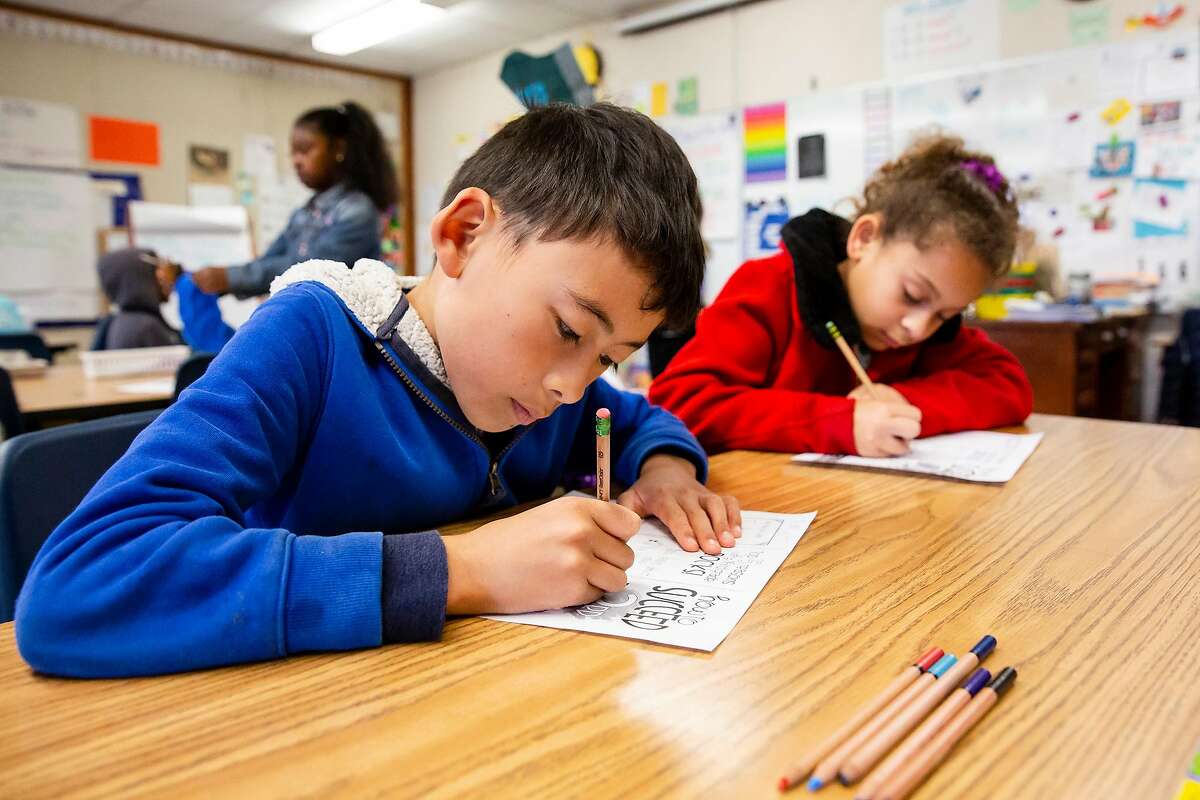 August Chen Penningroth (left) and Olivia Spencer write with compostable unpainted vegetable ink and cedar wood pencils in Jackie Omania's 3rd grade classroom at Oxford Elementary School in Berkeley, Calif. on Thursday, June 14, 2018. Jackie Omania and her students have turned their classroom into a zero-waste classroom, reducing their entire school year's supply of trash to one Mason jar.