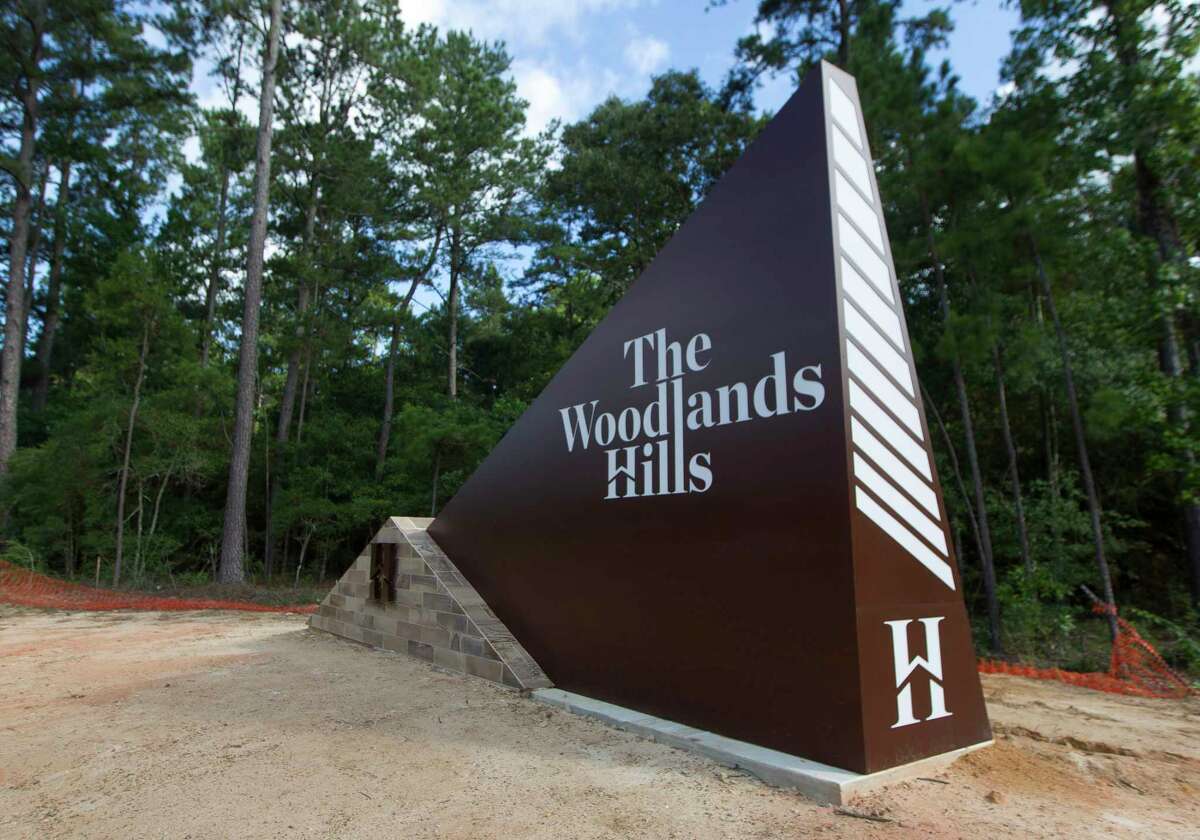 An entryway monument is seen along FM 830 for The Woodlands Hills. The city of Conroe has agreed to help widen Old Montgomery Road near The Woodlands Hills development to four lanes.
