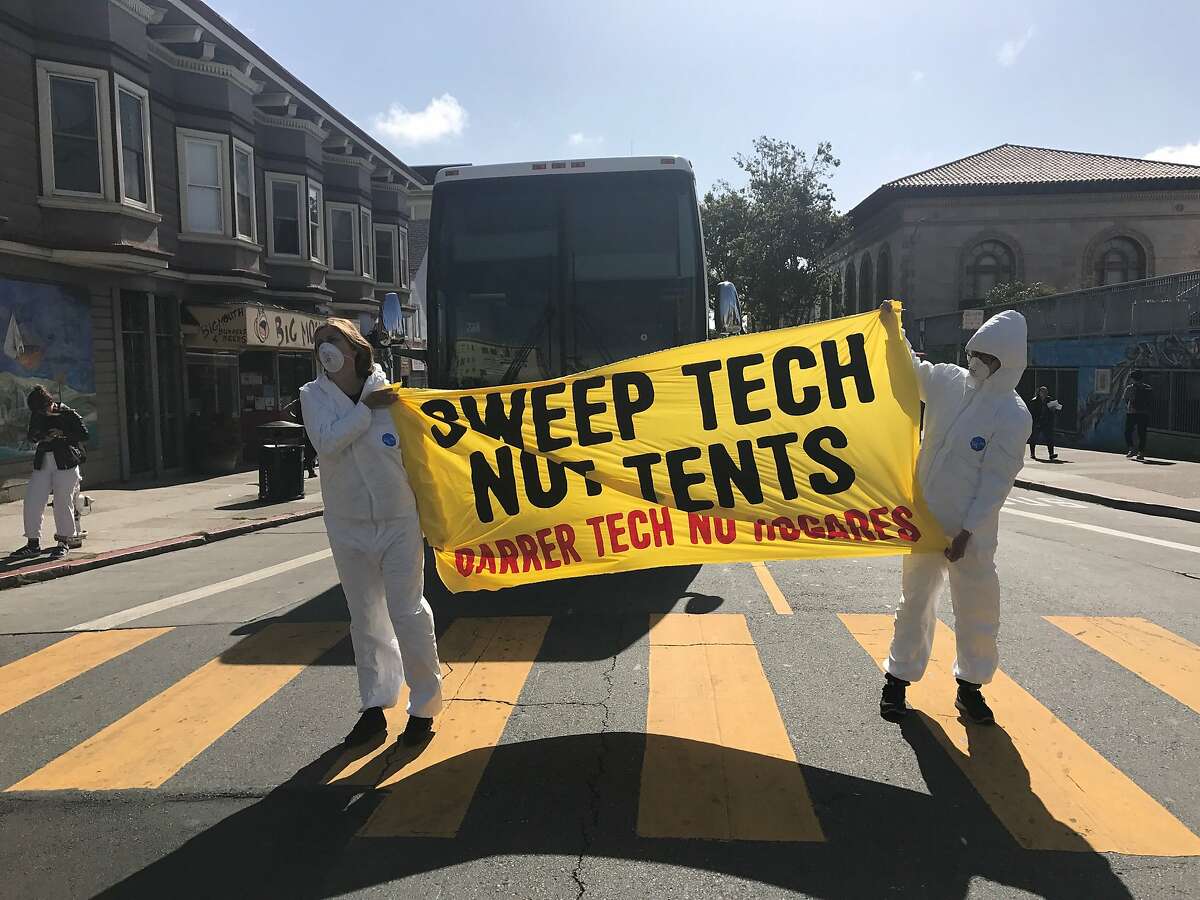 Protesters in the Mission District blocked tech buses from leaving San Francisco on Thursday morning, tossing scooters into the street to waylay the commuters.