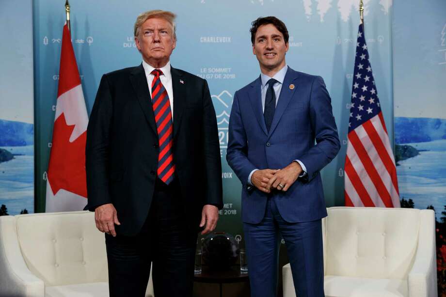 FILE - In this June 8, 2018 file photo, U.S. President Donald Trump meets with Canadian Prime Minister Justin Trudeau at the G-7 summit in Charlevoix, Canada. For the first time in decades, one of the world's most durable and amicable alliances faces serious strain as Canadians _ widely seen as some of the nicest, politest people on Earth _ absorb Donald Trump's insults against their prime minister and attacks on their countrys trade policies. (AP Photo/Evan Vucci, File) Photo: Evan Vucci / Copyright 2018 The Associated Press. All rights reserved.