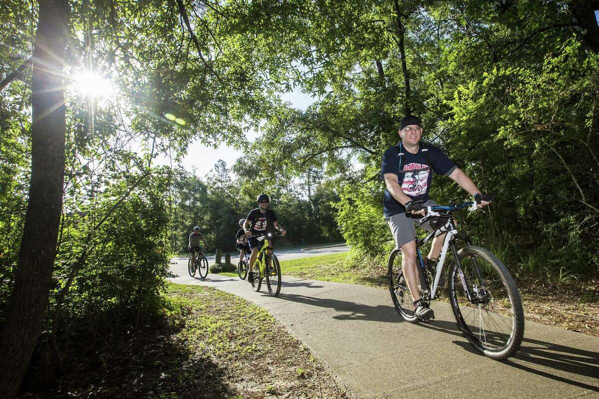 Gregg Hensley, ToppHeavvy president and Creekwood Middle School science teacher, leads the pack on their 9-mile Greenbelt Trails course during the 2nd Annual Vet Ride on May 24, 2014, in Kingwood. The ride through the Kingwood Greenbelt benefits the Humbe Area Veteran Honor Garden at Creekwood Middle School.