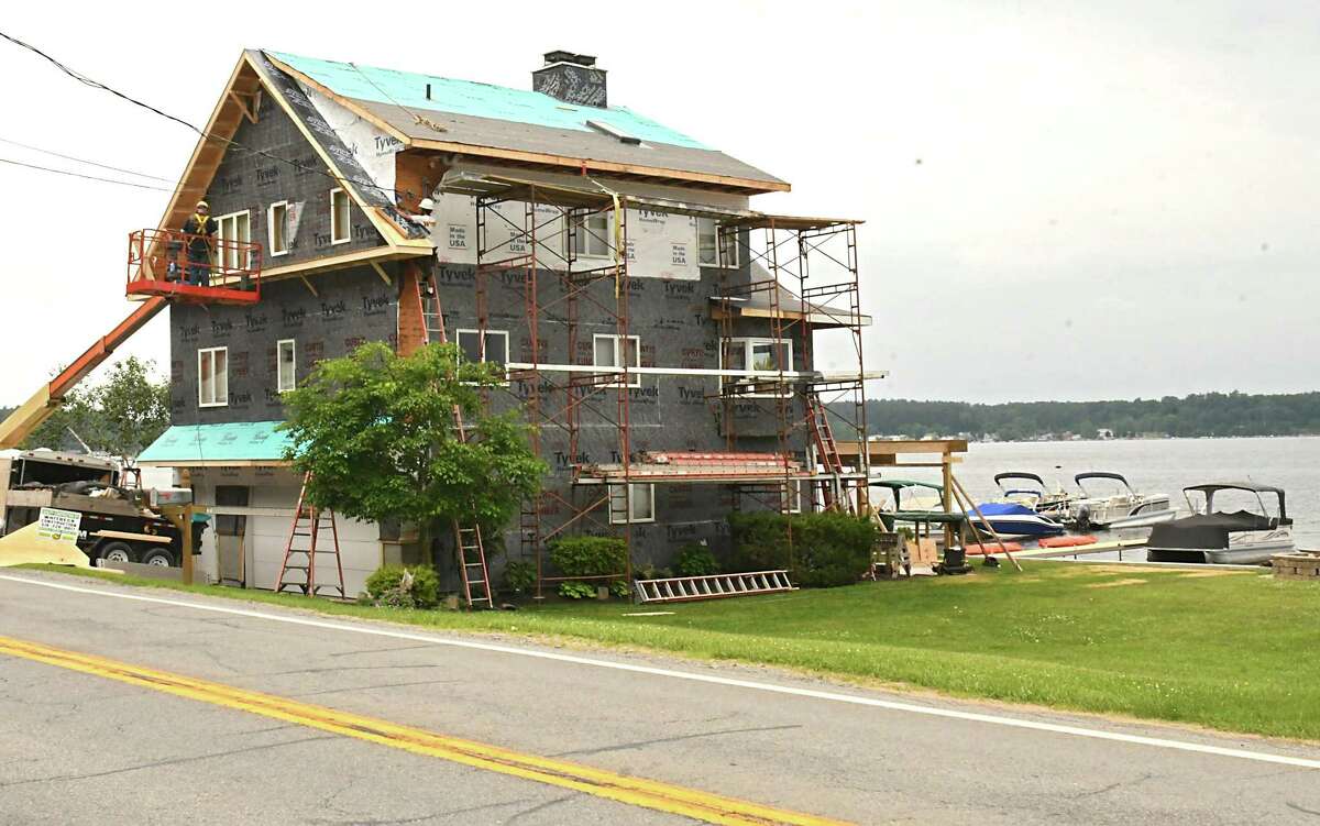 A lake front home gets an exterior renovation on Saratoga Lake on Wednesday, June 13, 2018 in Stillwater, N.Y. (Lori Van Buren/Times Union)