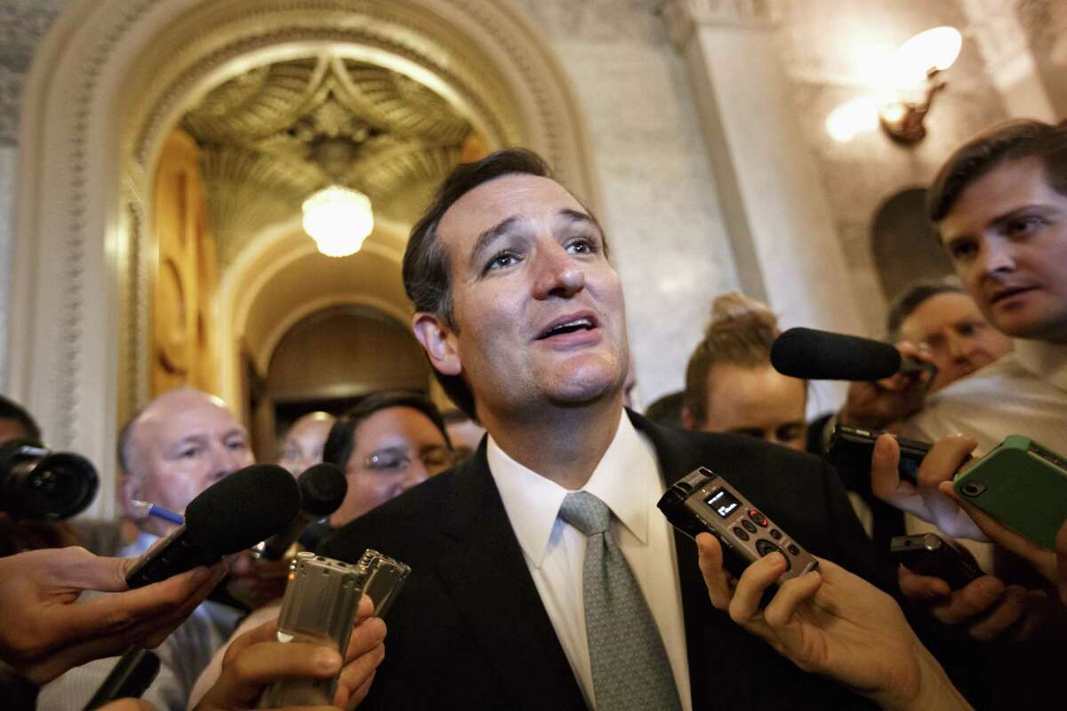 Sen. Ted Cruz, R-Texas talks to reporters as he emerges from the Senate Chamber on Capitol Hill in Washington, Wednesday, Sept 25, 2013, after his overnight crusade railing against the Affordable Care Act, popularly known as "Obamacare." Cruz ended the marathon Senate speech opposing President Barack Obama's health care law after talking for 21 hours, 19 minutes. (AP Photo/J. Scott Applewhite)