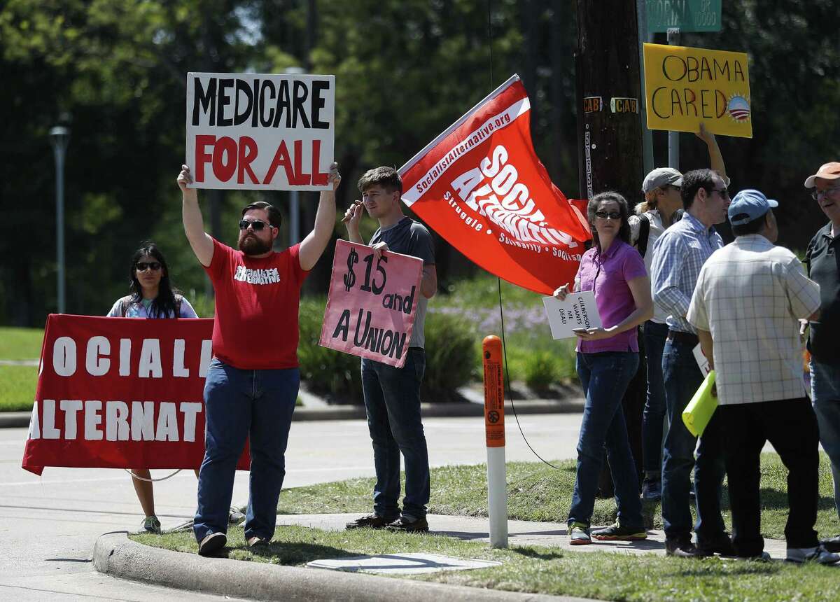 People protest against the AHCA outside of Representative John Culberson's office on Memorial Drive, Sunday, May , 2017, in Houston. ( Karen Warren / Houston Chronicle )