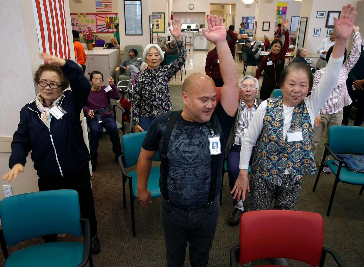 Arnel Valle conducts a dance movement program for clients at an On Lok senior center on Bush Street in San Francisco, Calif. on Friday, June 15, 2018. Valle recently completed training on caring for LGBT seniors with dementia.