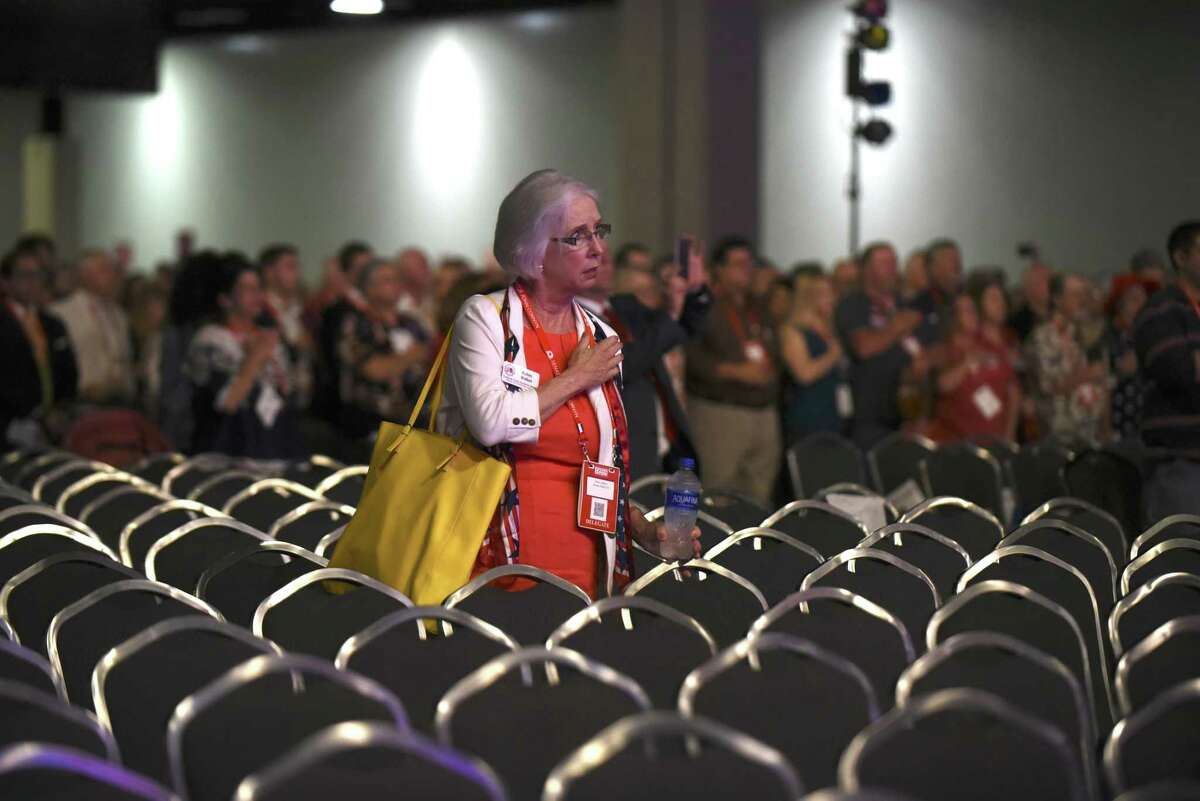 Robin Walker recites the Pledge of Allegiance at the Republican Party of Texas convention at the Henry B. Gonzalez Convention Center on Friday, June 15, 2018. Gov. Greg Abbott spoke shortly afterward.