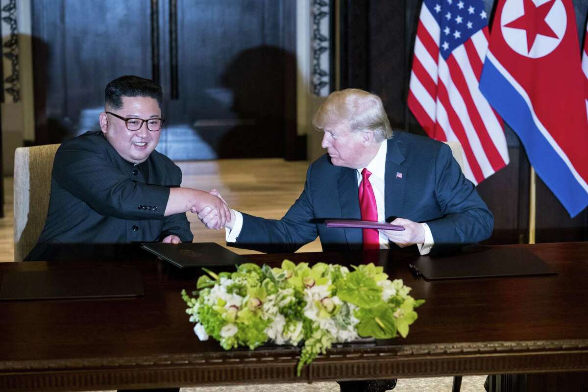 President Donald Trump and Kim Jong Un of North Korea during a document signing ceremony on Sentosa Island in Singapore on June 12. Since their meeting, a new propaganda film released in North Korea shows Kim as a global leader on an equal footing with Trump.