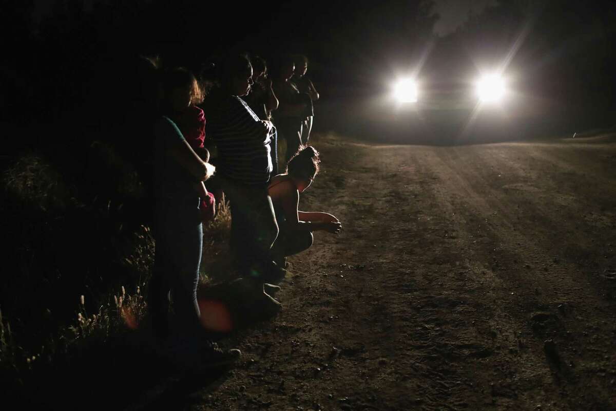 U.S. Border Patrol agents detain a group of Central American asylum seekers near the U.S.-Mexico border on June 12, 2018 in McAllen, Texas. The group of women and children had rafted across the Rio Grande from Mexico and were detained before being sent to a processing center for possible separation. Customs and Border Protection is executing the Trump administration’s “zero tolerance” policy toward undocumented immigrants. U.S. Attorney General Jeff Sessions also said that domestic and gang violence in immigrants’ country of origin would no longer qualify them for political asylum status.