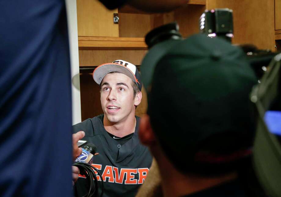 Oregon State pitcher Luke Heimlich answers reporters' questions in the clubhouse following practice at TD Ameritrade Park in Omaha, Neb., Friday, June 15, 2018. Oregon State plays North Carolina on Saturday in the NCAA College World Series baseball tournament.. (AP Photo/Nati Harnik) Photo: Nati Harnik / Copyright 2018 The Associated Press. All rights reserved.