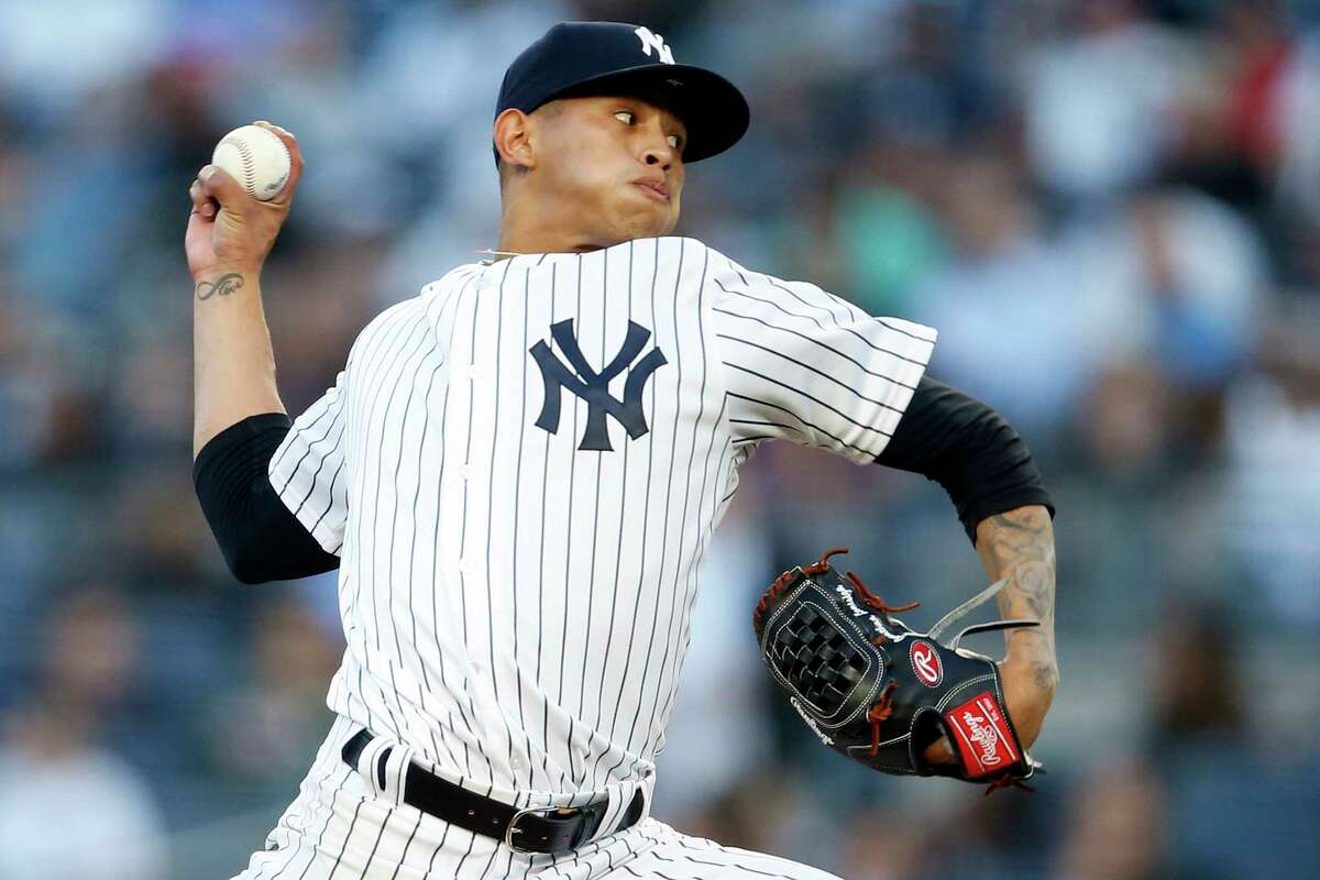 New York Yankees pitcher Jonathan Loaisiga delivers during the third inning of a baseball game against the Tampa Bay Rays, Friday, June 15, 2018, in New York. Loaisiga was making his major league debut. (AP Photo/Adam Hunger)