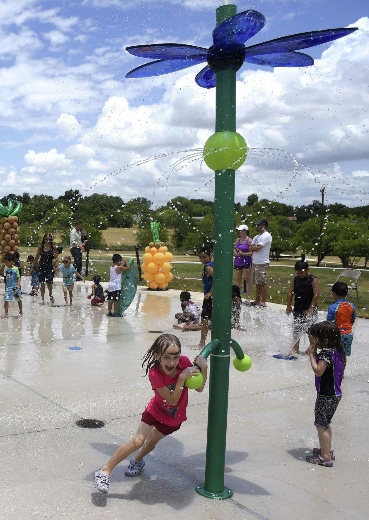 Children play on the new splash pad at Lincoln Park on San Antonio's Eastside on Saturday, June 16, 2018. H-E-B chairman and CEO Charles Butt personally donated $1 million for the redevelopment of the park to commemorate San Antonio's tricentennial. It was the first public park available to the African American community.
