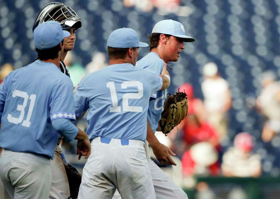 North Carolina pitcher Cooper Criswell, right, is congratulated by teammates Josh Ladowski (12) and Josh Hiatt (31) after the final out against Oregon State an NCAA College World Series baseball game in Omaha, Neb., Saturday, June 16, 2018. (AP Photo/Nati Harnik) Photo: Nati Harnik / Copyright 2018 The Associated Press. All rights reserved.