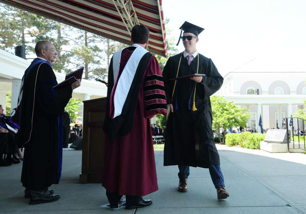Graduate Michael Adams, right, receives his diploma from President Stephen Ainlay during the Union College 224th Commencement Exercises on Sunday, June 17, 2018, in Schenectady, N.Y. (Paul Buckowski/Times Union)
