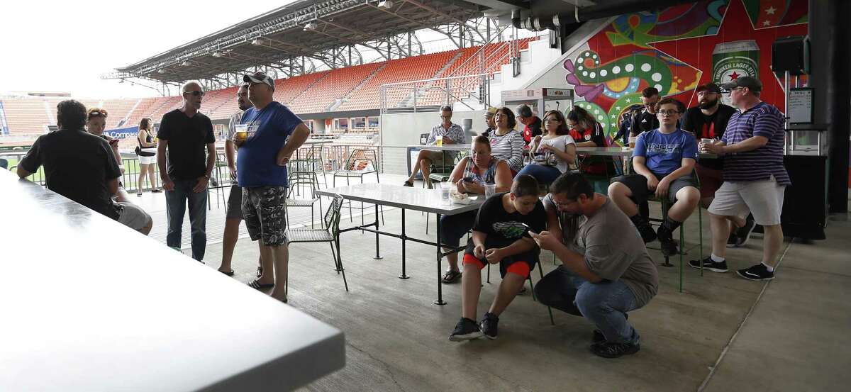 Fans watch Mexico and Germany face-off as the World Cup was live broadcast on jumbo screens during a Father?’s Day Free World Cup Watch Party at BBVA Compass Stadium, Sunday, June 17, 2018, in Houston. Houston-area families were invited to celebrate Father?’s Day as Mexico and Germany faced-off as the World Cup was live broadcast on jumbo screens at BBVA Compass Stadium. ( Karen Warren / Houston Chronicle )